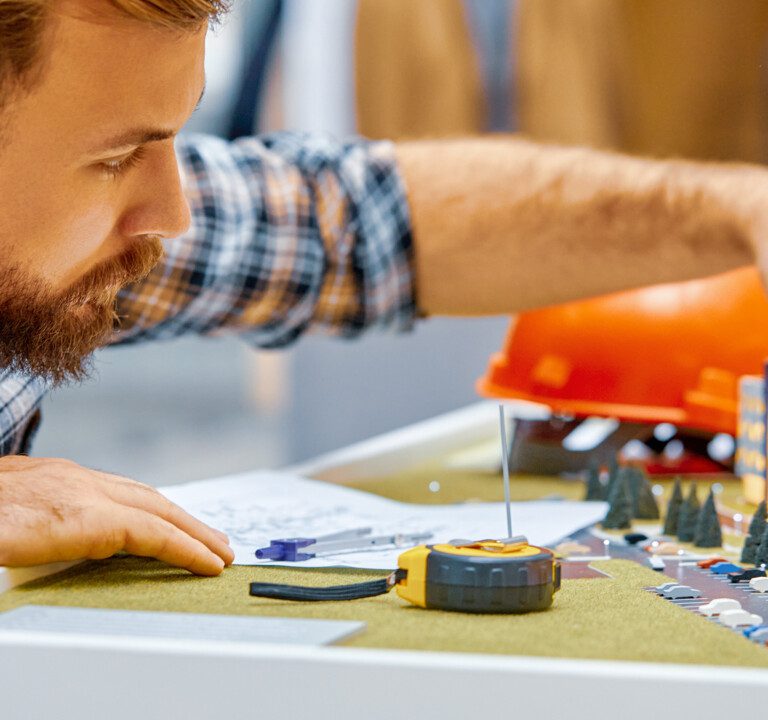 Young student architect working on architectural project concept