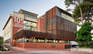 An image of the front of the refurbished TL Robertson Library at sundown.