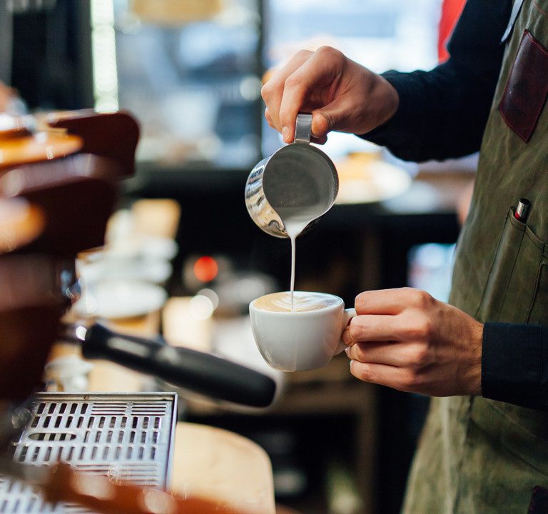 Barista pouring coffee.