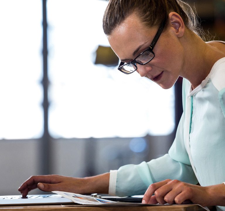 Woman working on laptop.