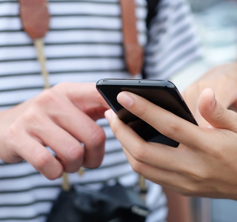 Students using smartphone.