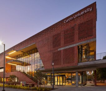 An external photo of a Curtin University Midland Campus building during sunset