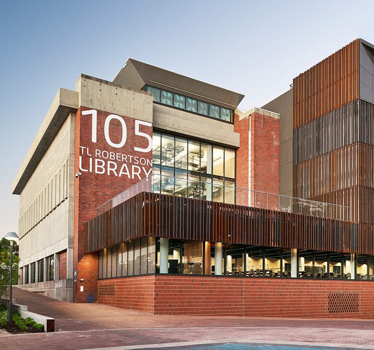 An image of the front of the refurbished TL Robertson Library at sundown.